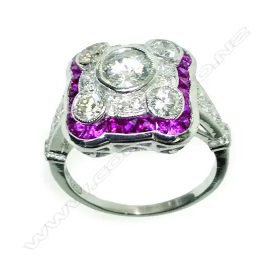 An Art Deco style 10ct. white gold diamond and ruby ring