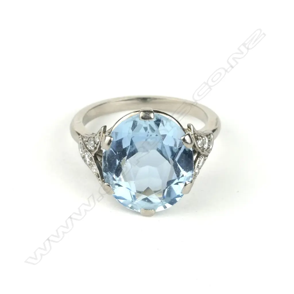 An 18ct. white gold aquamarine and diamond ring Image 1++