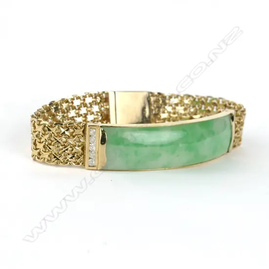 An 18ct. gold jadeite and diamond bracelet
