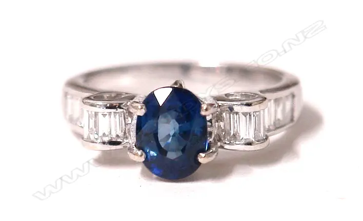 An 18ct. white gold sapphire and diamond dress ring Image 1++