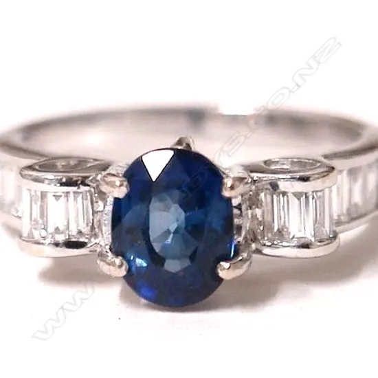 An 18ct. white gold sapphire and diamond dress ring
