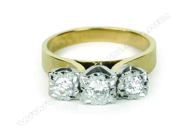 An 18ct. gold and three diamond ring Image 1++