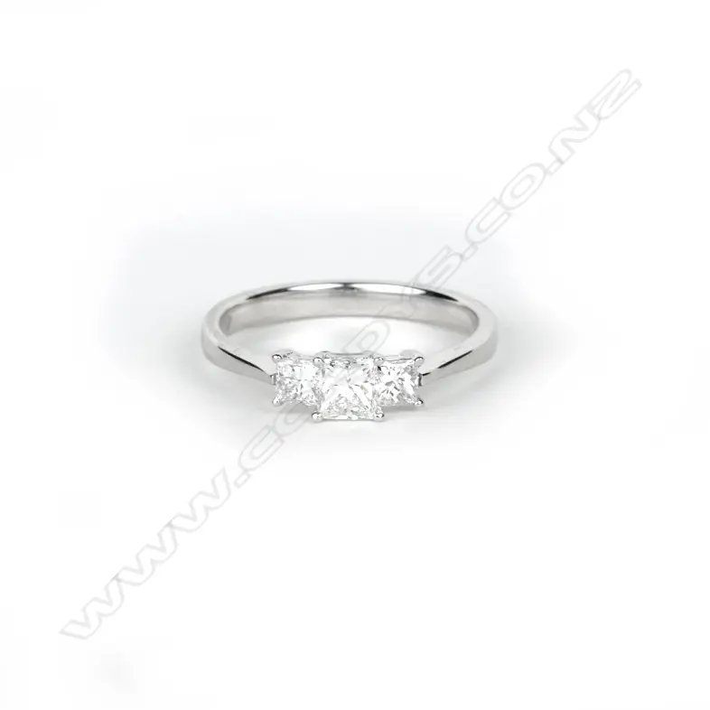 An 18ct. white gold and three stone diamond ring Image 1++