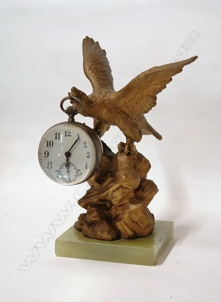A 19thC gilt spelter eagle alighting and suspended ball clock Image 1++