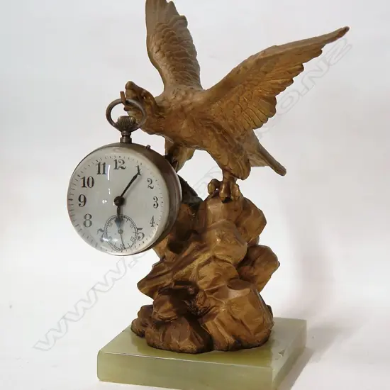 A 19thC gilt spelter eagle alighting and suspended ball clock
