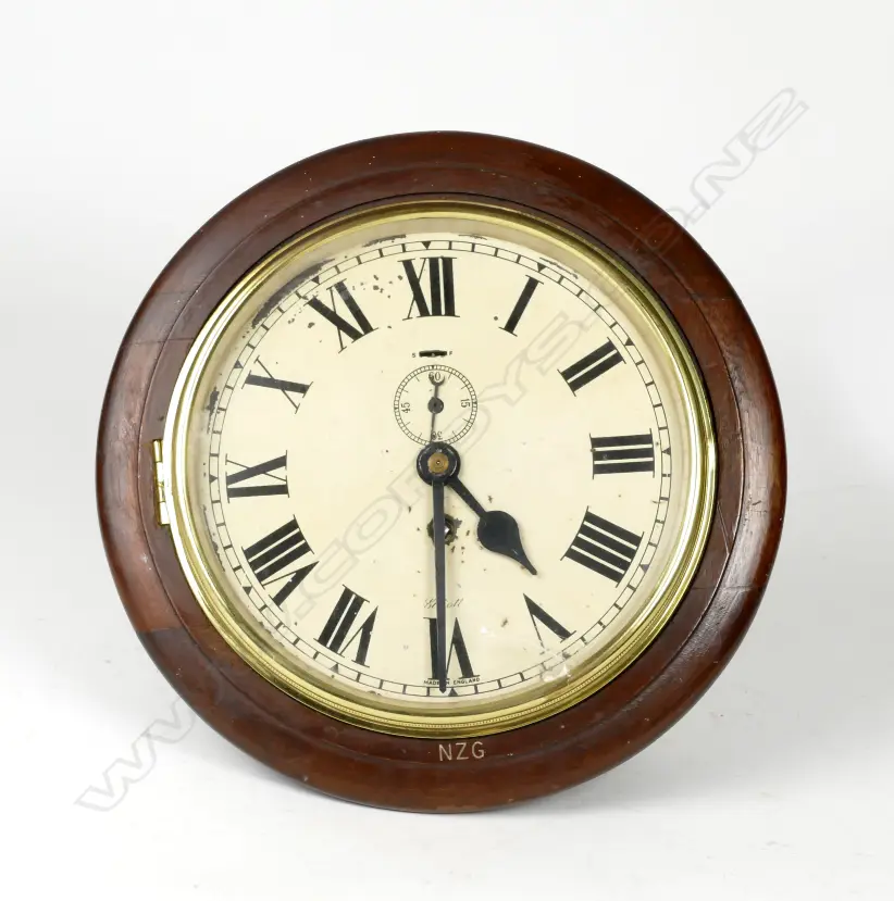 A mahogany framed circular wall clock by Elliot Image 1++