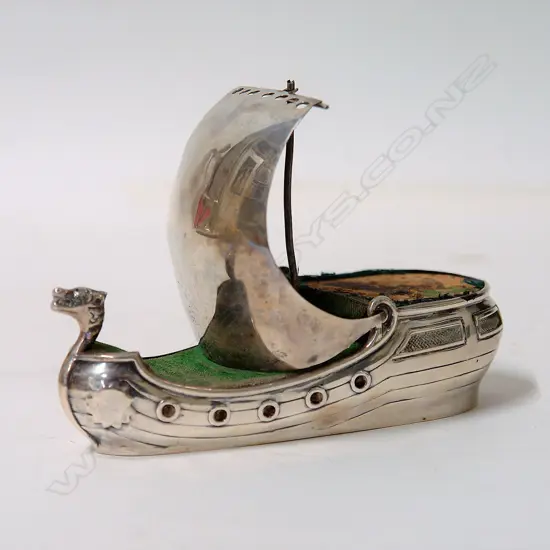 An early 20thC silver Arts & Crafts Viking ship pin cushion