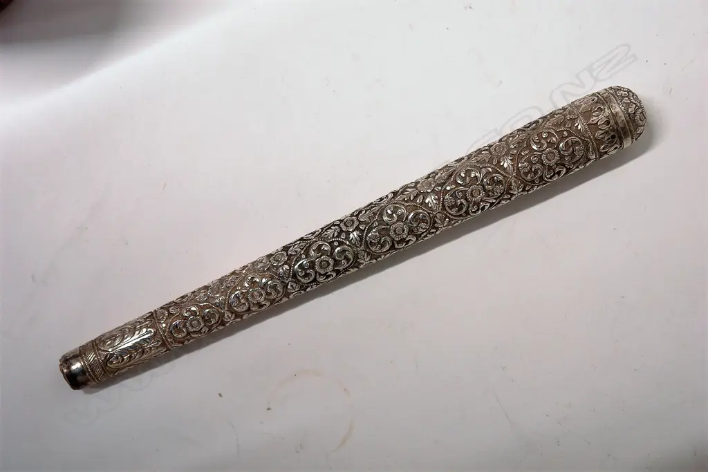 An Eastern silver finely embossed cane handle Image 1++