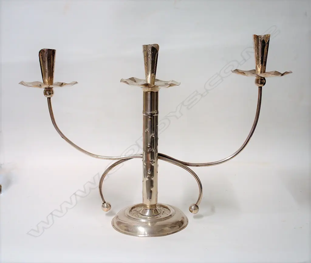 An uncommon N.Z. Arts & Crafts silver table candelabra Image 1++