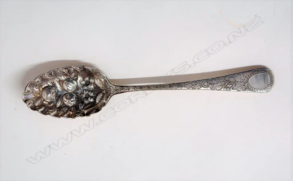 A George III silver berry spoon Image 1++