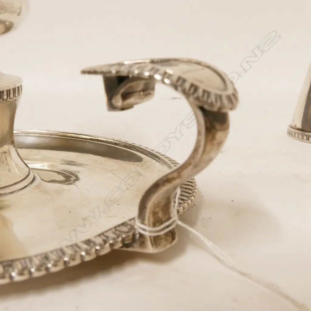 A pair of George III Irish silver chambersticks Image 1++