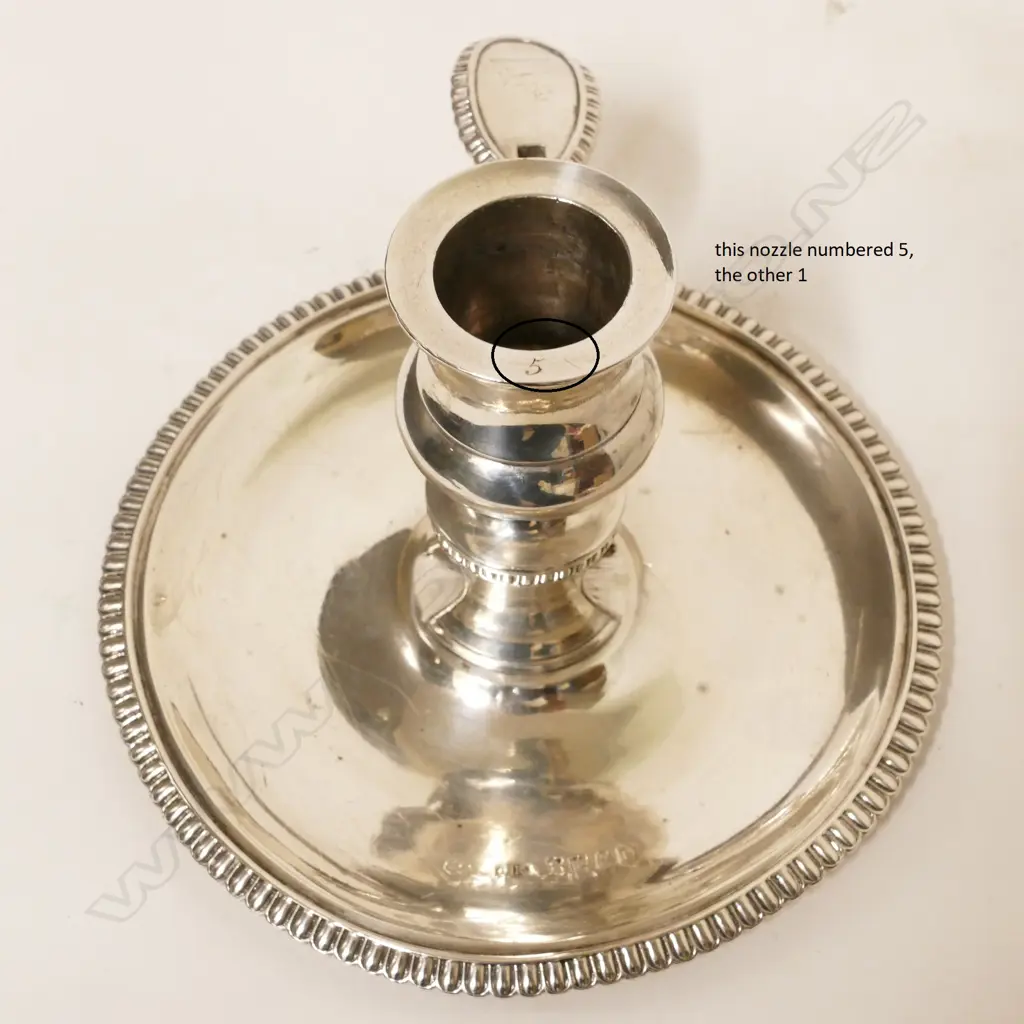 A pair of George III Irish silver chambersticks Image 1++
