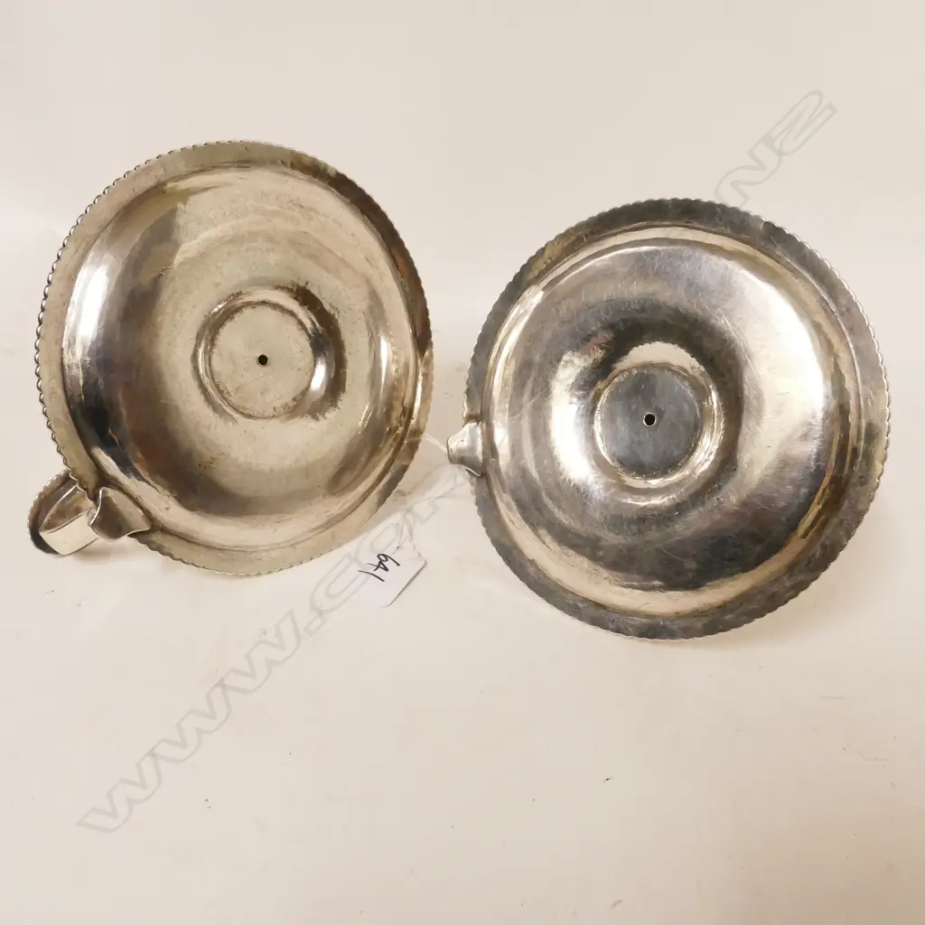 A pair of George III Irish silver chambersticks Image 1++