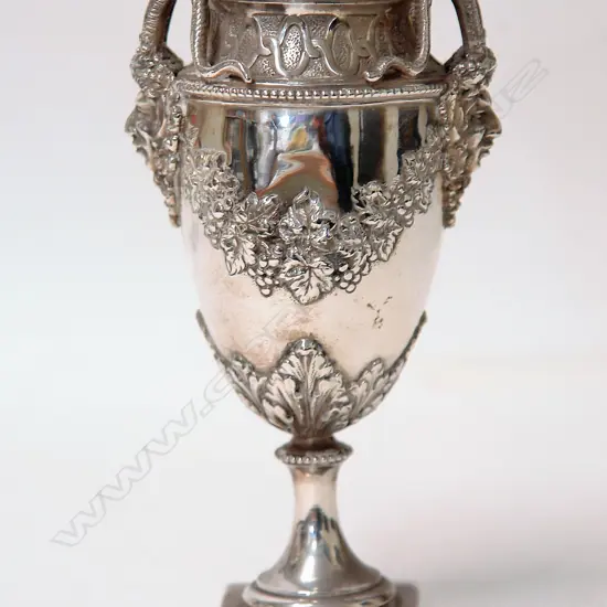 A late 19thC German Hanau Bacchanalian silver urn form vase