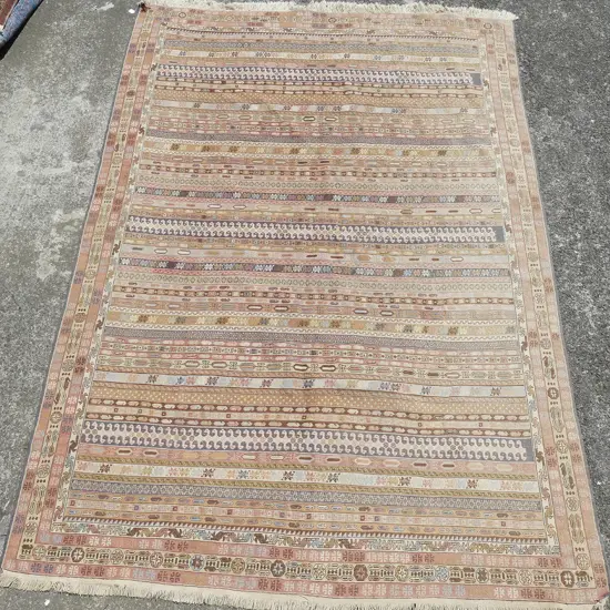 A large Shiraz woven carpet