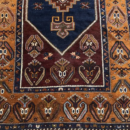 A fine hand knotted Persian Kazak rug