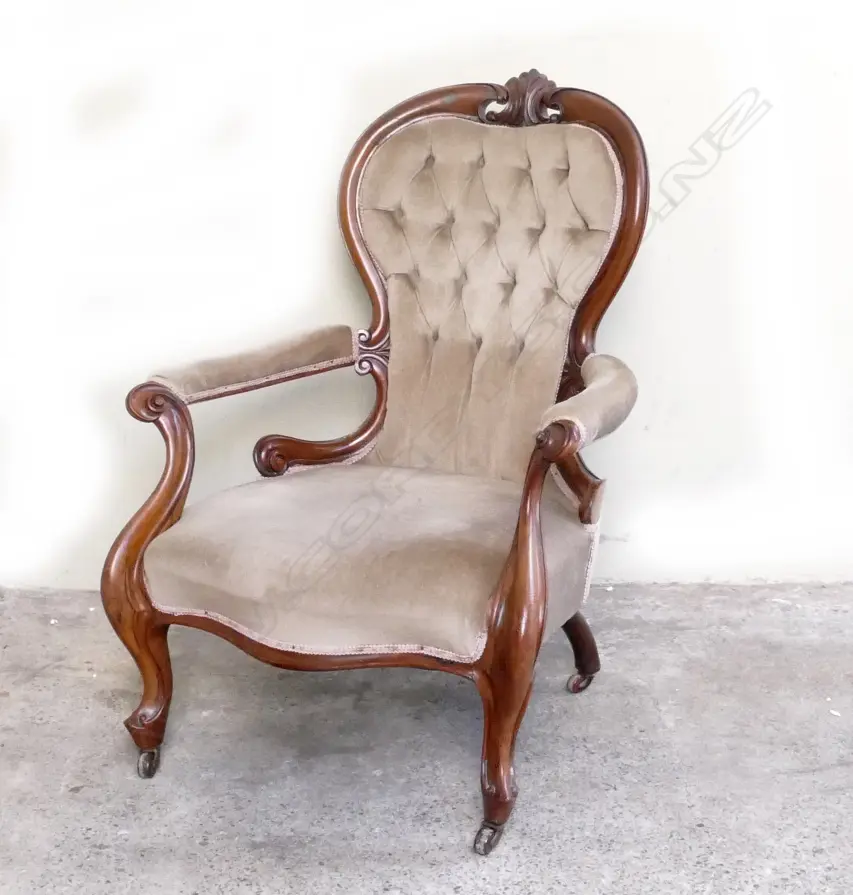 A Victorian walnut open elbow armchair Image 1++