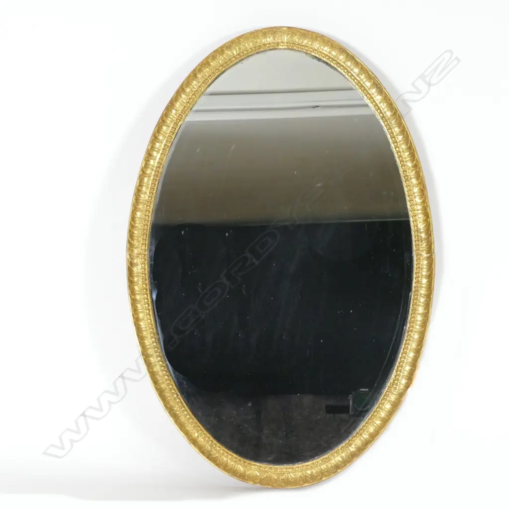 An oval giltwood framed mirror Image 1++