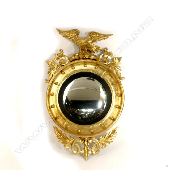 A 19thC circular wall mirror of Regency style