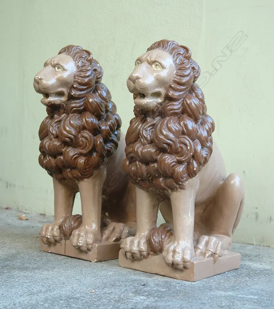 A pair of early/mid 20thC cast composite classical seated lions Image 1++
