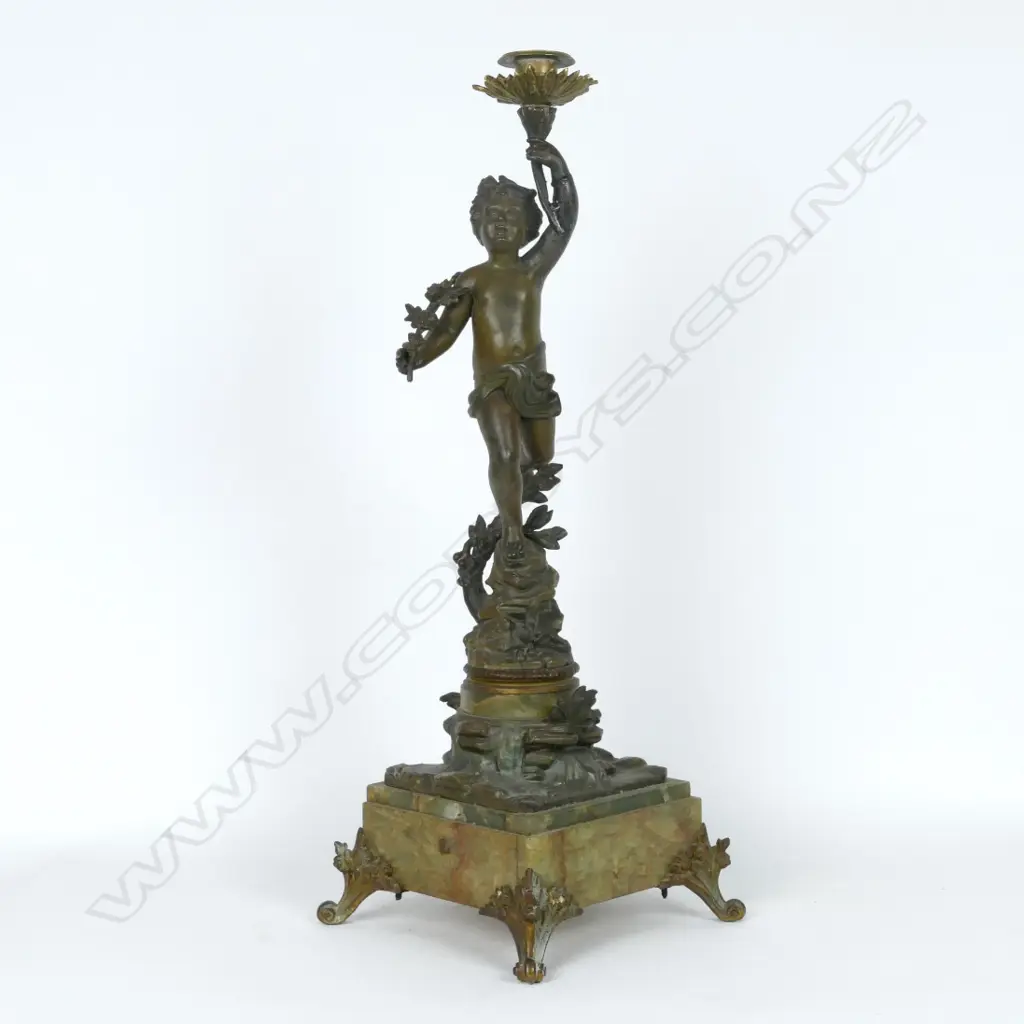 A spelter bronzed figural candlestick Image 1++