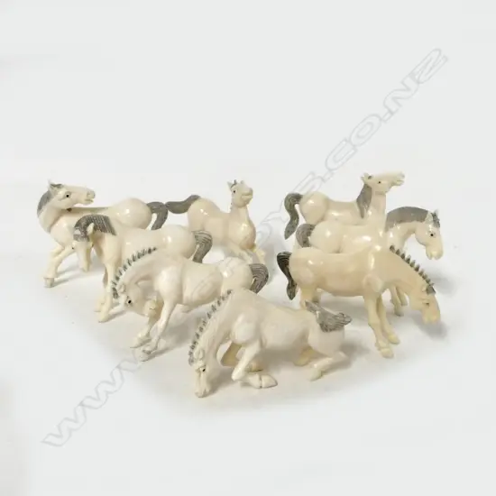 Eight miniature ivory horses