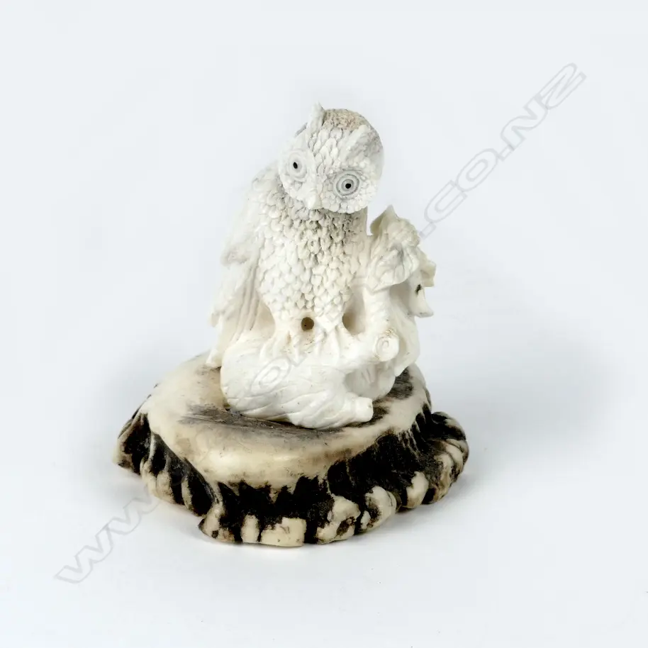 A small carved antler figure Image 1++