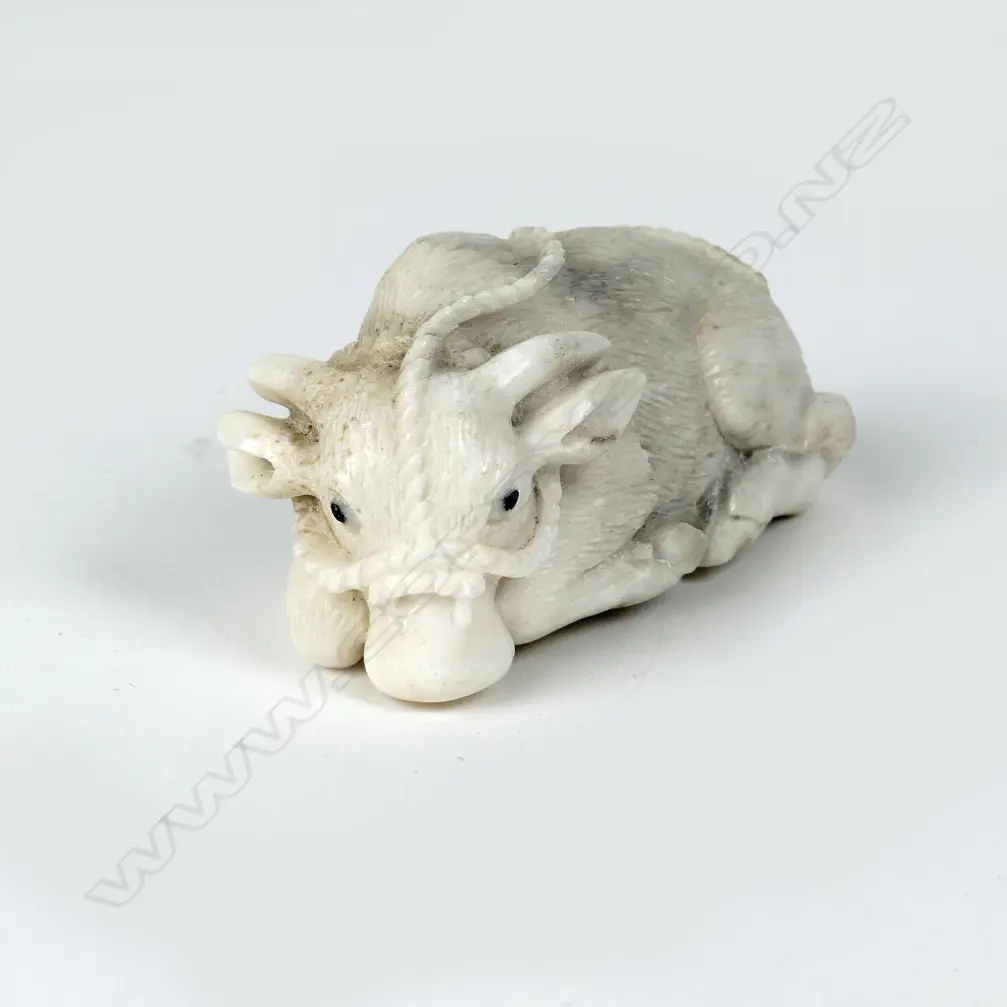 A small antler carving in the form of a water buffalo calf Image 1++