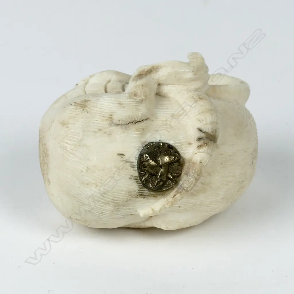 A small antler carving in the form of a rat rolling on his back Image 1++