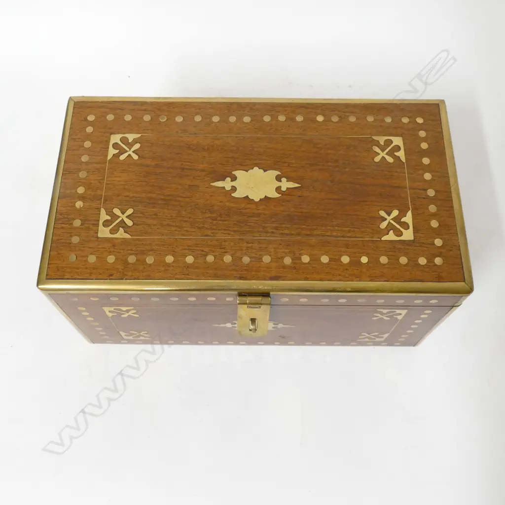 A teak oblong box with brass inlay and clashed edges Image 1++