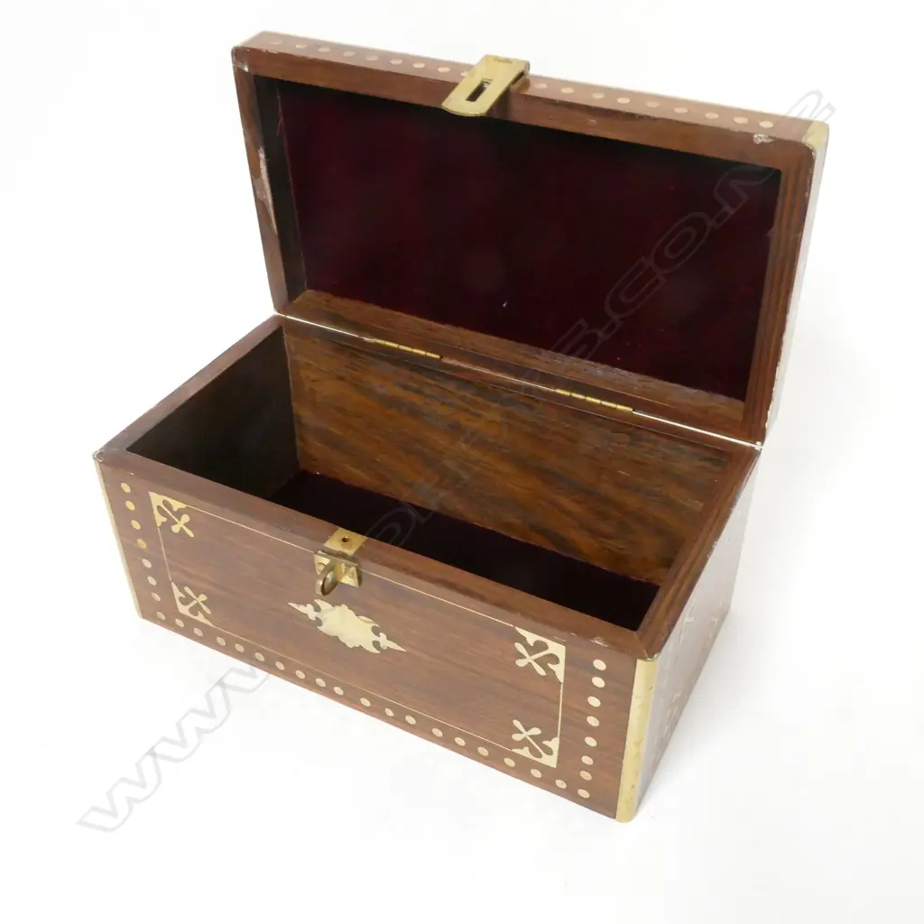 A teak oblong box with brass inlay and clashed edges Image 1++