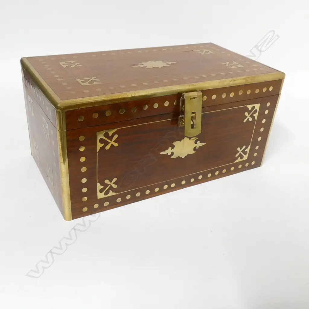 A teak oblong box with brass inlay and clashed edges Image 1++