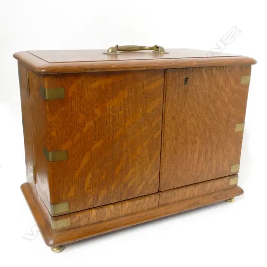 A Victorian quartered oak decanter case