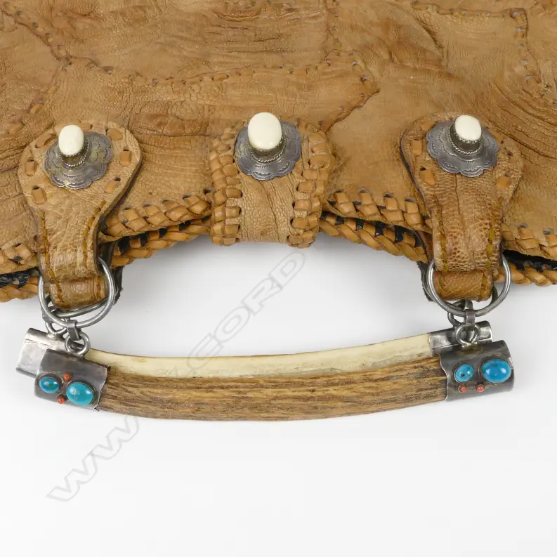 A vintage crocodile skin handbag Image 1++