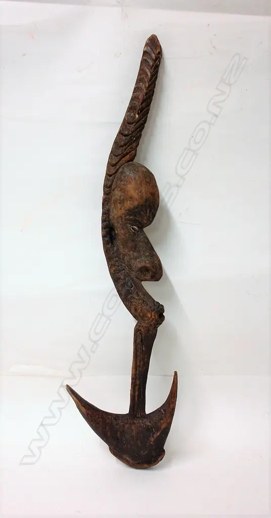 A PNG carved wooden food hook Image 1++