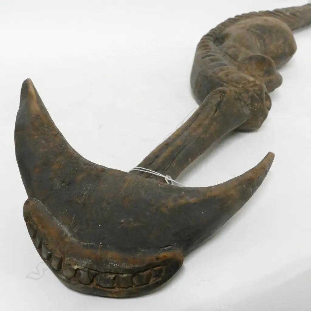 A PNG carved wooden food hook Image 1++
