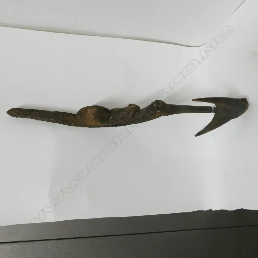A PNG carved wooden food hook Image 1++
