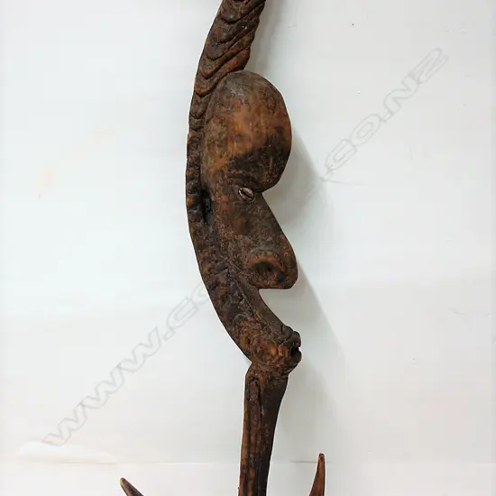 A PNG carved wooden food hook