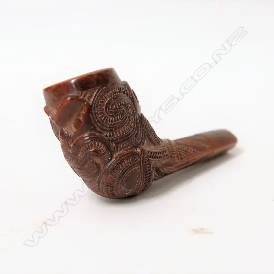 An early 20thC finely carved Maori pipe bowl end