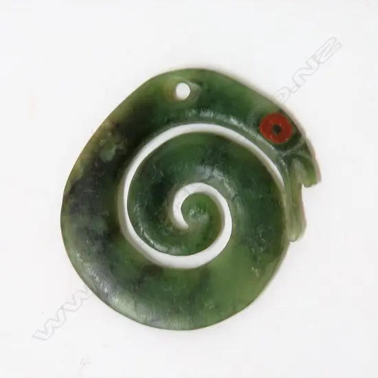An old Maori pounamu carved manaia koropepe