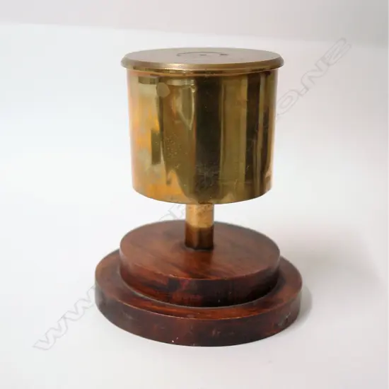 A table bell made from a 1941 brass 3.7" Howitzer shell