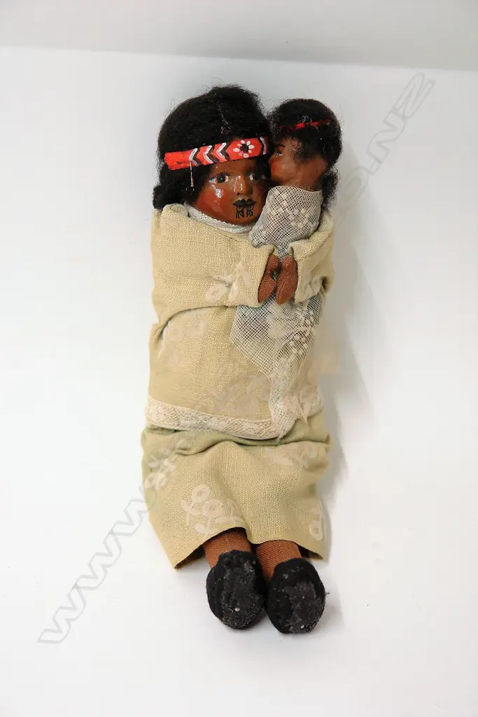 A vintage composite and cloth bodied Maori mother and child doll Image 1++