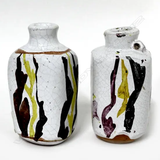 A rare pair of Chester Nealie glazed 'poison' bottles