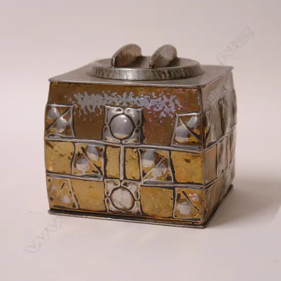 An Archibald Knox design pewter biscuit box