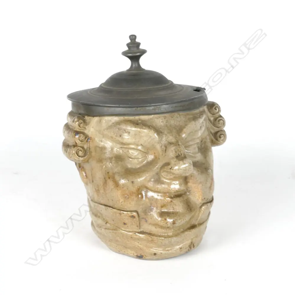 A stoneware pot modelled as the head of a wigged lawyer Image 1++