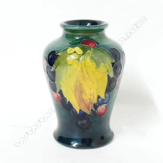 A small William Moorcroft 'Leaf and Berry' vase