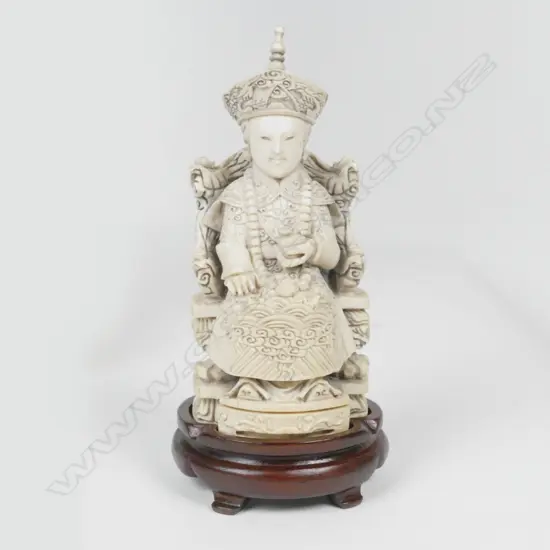 A Chinese carved solid ivory figure of an empress