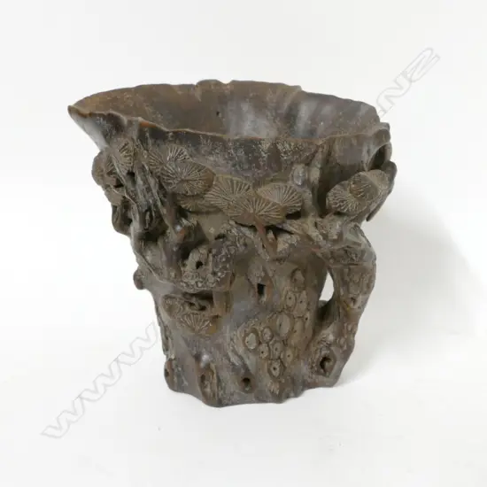 A carved centred wood libation cup