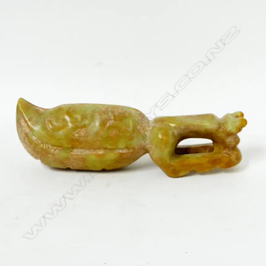 An archaic style jade sculpture of a large praying mantis Image 1++