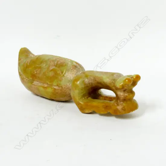 An archaic style jade sculpture of a large praying mantis